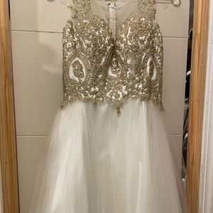 I’m selling this Beautiful white short dress worn once very shiny and bling.